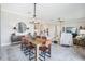 Open concept dining room with modern furnishings, flowing into living and kitchen areas at 31510 Cabana Rye Ave, San Antonio, FL 33576