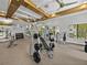 Gym space with weight machines and free weights with a ceiling featuring wooden beams at 31510 Cabana Rye Ave, San Antonio, FL 33576