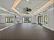Spacious gym with mirrors, rubber floor, high ceilings, ceiling fans, and recessed lighting at 31510 Cabana Rye Ave, San Antonio, FL 33576