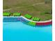 A line of colorful kayaks are lined up on the beach of the community's resort-style swimming pool and recreation area at 31510 Cabana Rye Ave, San Antonio, FL 33576