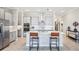 Bright and modern kitchen with an island, stainless steel appliances, and updated fixtures at 31510 Cabana Rye Ave, San Antonio, FL 33576