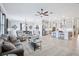 Open concept living room featuring modern decor, a ceiling fan, and plenty of natural light at 31510 Cabana Rye Ave, San Antonio, FL 33576