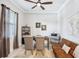 Home office with neutral walls, ceiling fan, and comfortable seating area for work or relaxation at 31510 Cabana Rye Ave, San Antonio, FL 33576