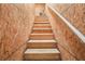 Unfinished staircase with wooden planks, providing access to upper levels of the house at 31510 Cabana Rye Ave, San Antonio, FL 33576