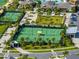 Stunning shot of tennis courts, lush landscaping, and other community amenities in a modern planned community at 31510 Cabana Rye Ave, San Antonio, FL 33576