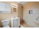 Beautiful bathroom featuring a tiled shower with built-in niche, modern vanity, and ample lighting at 3303 W Ballast Point Blvd, Tampa, FL 33611