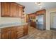 Spacious kitchen with stainless steel appliances, granite countertops, and warm wood cabinetry at 3303 W Ballast Point Blvd, Tampa, FL 33611