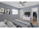 Cozy main bedroom with a ceiling fan, bright paint, and a view of the closet at 3303 W Ballast Point Blvd, Tampa, FL 33611