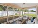 Relax in the sun room offering lots of sunshine and a view of the fenced in backyard at 3303 W Ballast Point Blvd, Tampa, FL 33611
