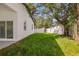 Large, well-maintained backyard with a white fence, perfect for outdoor activities at 331 Archimedes St, Dunedin, FL 34698