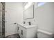 Modern bathroom featuring double vanity, quartz countertops, and updated fixtures at 331 Archimedes St, Dunedin, FL 34698