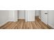 Neutral bedroom featuring wood floors, white trim, and doors at 331 Archimedes St, Dunedin, FL 34698