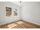 Bright bedroom featuring wood floors, and scenic views from the windows at 331 Archimedes St, Dunedin, FL 34698