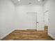 Neutral bedroom featuring wood floors, white trim, and closet at 331 Archimedes St, Dunedin, FL 34698
