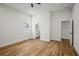 Spacious bedroom with wood floors, view of the ensuite bathroom, and white trim at 331 Archimedes St, Dunedin, FL 34698