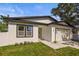 Beautiful single-story house with a well-kept yard and an attached garage at 331 Archimedes St, Dunedin, FL 34698