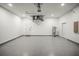 This spacious garage features epoxy floors and plenty of room for storage and parking at 331 Archimedes St, Dunedin, FL 34698