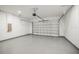 Spacious garage featuring epoxy floors and an automatic door for easy access and convenience at 331 Archimedes St, Dunedin, FL 34698