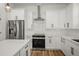 Well-equipped kitchen features stainless steel appliances, modern cabinetry, and ample counter space for meal preparation at 331 Archimedes St, Dunedin, FL 34698