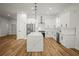 Modern kitchen with stainless steel appliances, a large island, and updated cabinetry, perfect for cooking and entertaining at 331 Archimedes St, Dunedin, FL 34698