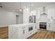 Bright kitchen featuring a large island, stainless steel appliances, and wood-look flooring at 331 Archimedes St, Dunedin, FL 34698