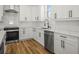 Modern kitchen design with white cabinets, stainless steel appliances, and elegant countertops for a clean and inviting space at 331 Archimedes St, Dunedin, FL 34698