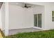 Covered outdoor patio area perfect for entertaining or relaxing with a fan and nice backyard view at 331 Archimedes St, Dunedin, FL 34698