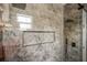 Modern shower with tile surround, rainfall shower head, and built-in niche at 331 Archimedes St, Dunedin, FL 34698