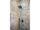 Modern shower features a marble-look tile surround, rainfall shower head and built-in shelf at 331 Archimedes St, Dunedin, FL 34698