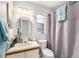 Full bathroom with modern vanity and shower and tub combo with a shower curtain at 3343 Fox Hunt Dr, Palm Harbor, FL 34683