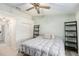 This bedroom features neutral paint, a ceiling fan, carpet and a closet with bi-fold doors at 3343 Fox Hunt Dr, Palm Harbor, FL 34683