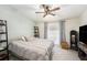Comfortable bedroom features neutral tones, carpet, ceiling fan and natural light at 3343 Fox Hunt Dr, Palm Harbor, FL 34683