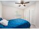 Bedroom with ceiling fan, closet with bi-fold doors and natural light from the window at 3343 Fox Hunt Dr, Palm Harbor, FL 34683