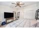 Cozy bedroom with closet and natural light from window, enhanced by modern ceiling fan at 3343 Fox Hunt Dr, Palm Harbor, FL 34683