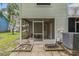 Screened lanai with access to patio and backyard offers seamless transition to outdoor living at 3343 Fox Hunt Dr, Palm Harbor, FL 34683