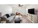 Bright living room featuring neutral decor, stylish furniture, and wood-look flooring at 3343 Fox Hunt Dr, Palm Harbor, FL 34683