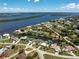 Waterfront homes feature access to the Gulf and verdant tropical landscaping at 3420 Santa Clara Dr, Punta Gorda, FL 33983