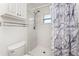 Clean bathroom featuring a shower with tile surround, shower head, and toilet at 3420 Santa Clara Dr, Punta Gorda, FL 33983