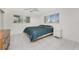 Bright bedroom with tile floors, two windows, ceiling fan and dresser at 3420 Santa Clara Dr, Punta Gorda, FL 33983