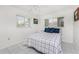 Bedroom with tile floors, two windows, ceiling fan, and queen bed at 3420 Santa Clara Dr, Punta Gorda, FL 33983