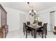 Cozy dining room with a modern chandelier and seating for four at 3420 Santa Clara Dr, Punta Gorda, FL 33983