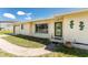 Attractive single-story home featuring a well-kept lawn, decorative sea horse accents, and a welcoming front entrance at 3420 Santa Clara Dr, Punta Gorda, FL 33983