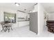 Bright dining area with modern chandelier, seamlessly connected to the kitchen and living room at 3420 Santa Clara Dr, Punta Gorda, FL 33983
