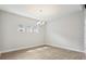 Cozy dining room with decorative lighting, hardwood floors, and bright, neutral paint at 35280 Big Hawk Ln, Zephyrhills, FL 33541
