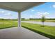 Covered patio and serene water view at 35571 Stableton Ln, Zephyrhills, FL 33541