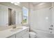 Bright bathroom with vanity, bathtub, and shower at 35571 Stableton Ln, Zephyrhills, FL 33541