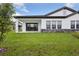 Beautiful backyard featuring stone accents at 35579 Stableton Ln, Zephyrhills, FL 33541