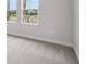 Bedroom with neutral carpet, baseboard, walls and windows at 35579 Stableton Ln, Zephyrhills, FL 33541