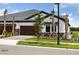 Charming home with a two-car garage, well-manicured landscaping, and a modern exterior at 35579 Stableton Ln, Zephyrhills, FL 33541