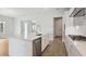 Well-designed kitchen with a large island, stainless steel dishwasher and sleek countertops at 35579 Stableton Ln, Zephyrhills, FL 33541